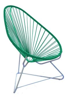 a green chair sitting on top of a white floor next to a metal stand with two legs