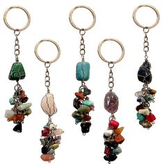 four different colored stones hanging from metal rings