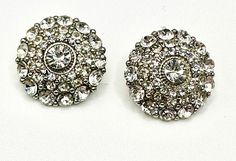 Stunning pair of art deco styled vintage crystal studs  for pierced ears  in a fantastic vintage 1950's condition  a round silver plate base  with a slight dome  sits multi  round cut rhinestone crystals  stacked in 3 layers in various size rounds  to a single large central crystal  all spaced with silver prongs  with a fantastic sparkle  the back set with detail  sure to be noticed in these ultra glam deco ear studs  vintage at its best  size 2.5 x 2.5 cm  dome height 7mm  weight each stud  7 grams Silver Vintage Clip-on Earrings For Vintage Events, Antique Silver Clip-on Earrings For Wedding, Silver Earrings With Bling, Silver Bling Round Earrings, Silver Bling Earrings, Formal Crystal Round Clip-on Earrings, Silver Round Clip-on Earrings For Party, Silver Round Earrings With Rhinestones, Vintage Sparkling Round Jewelry