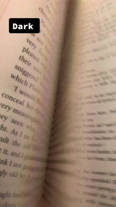 an open book with the words dark on it's page and text below that reads,