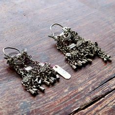 These dangle earrings are antiques that originate from the Qing Dynasty, where a noble woman would have worn an intricate design such as this for a special occasion.Antique stock, made by hand in the late 19th or early 20th century. Length 3 1/2 to 4 1/2 inches. Elegant Oxidized Chandelier Earrings For Festivals, Victorian Style Ceremonial Dangle Earrings, Victorian Style Ceremonial Earrings For Pierced Ears, Elegant Ceremonial Danglers Drop Earrings, Elegant Ceremonial Drop Danglers, Elegant Ceremonial Chandelier Earrings, Elegant Oxidized Chandelier Earrings For Weddings, Elegant Drop Danglers For Ceremonial Occasions, Antique Ceremonial Earrings