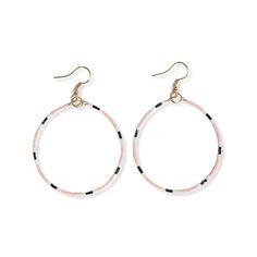 Lightweight, dainty, yet impactful, these front-facing hoops are what everyday earring dreams are made of. This slender silhouette of glass beads in light pink white and black stripes is where classic colors meet modern design. Style tip: Blush pink is a neutral in our book. Try stepping out of your comfort zone by pairing with complimentary colors + see what happens. Confidence looks good on you, friend. Recycled Gifts, Out Of Your Comfort Zone, Complimentary Colors, Human Hand, Beaded Hoop Earrings, Beaded Hoops, Rainbow Color, Everyday Earrings, Initial Charm