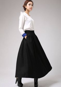 "This black wool skirt designed with pleated front and high fitted waist. Also, two hip pockets and side zip closure for more convenient wear. It is made of soft wool blend and it has lining.the lady skirt with a maxi length is really a good choice for winter. This skirt can be a basic piece in your wardrobe. Due to it classic cut and rich solid color it can be easily matches with many different styles. DETAIL * 30% wool, 30% fiber, 40% polyester * polyester lining * Seam pocket * Right zipper c Pleated Maxi Skirt For Winter Workwear, Winter Pleated Full Maxi Skirt, Winter High Waist Pleated Maxi Skirt, Formal Pleated Midi Skirt With Pockets, Elegant Flared Maxi Skirt With Pockets, High Waist Pleated Maxi Skirt For Winter, Black Maxi Skirt With Pockets For Fall, Winter Full Maxi Skirt With Pockets, Elegant Fall Maxi Skirt With Pockets