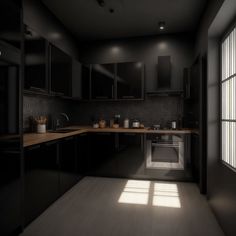 an empty kitchen with black cabinets and wooden counter tops is seen in this dark image