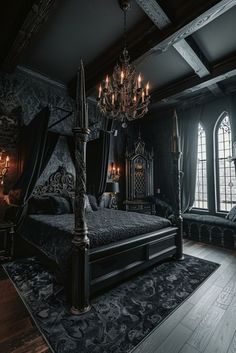 an ornate bedroom with black walls and wood flooring, chandelier and canopy bed