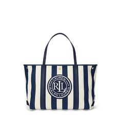 Crafted from woven herringbone twill yarn-dyed with the season’s striped pattern Lauren Ralph Lauren’s large Emerie tote is designed with a spacious convertible silhouette perfect for storing your essentials. The ultimate bag for every occasion whether it’s a weekend getaway or running errands it’s designed with pebbled leather straps and a nautical-inspired “LRL Lauren Ralph Lauren” logo patch at the front. Small Laptop, Ralph Lauren Logo, Polo Sport, Weekend Getaway, Yarn Dyeing, Week End, Lauren Ralph Lauren, Handbag Accessories, Pebbled Leather