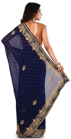 Georgette Festive Saree in Blue with Cut Dana work Product Details: Fabric:Georgette Work:Bugle Beads, Cut Dana, Thread Color Family:Blue Style:Classic Occasion:Engagement, Festive, Mehendi Sangeet, Reception Saree Dimension:530 Cm x 110 Cm ( L x W) Blouse Length:80 Cm Approx(we provide stitched blouse at extra cost @ 15US$) You can send us the measurement through email. Otherwise we will send Unstitched Blouse and you can stitched at your end. Unstitched Blouse price is included in item price. Semi-stitched Royal Blue Blouse Piece For Wedding, Blue Pre-draped Saree With Dori Work, Blue Pre-draped Saree With Dori Work For Eid, Blue Pre-draped Saree With Dori Work For Festivals, Semi-stitched Pre-draped Saree With Dabka Work, Blue Unstitched Saree With Dabka Work, Blue Dori Work Saree For Eid, Blue Bollywood Saree With Dabka Work, Blue Self-design Georgette Lehenga