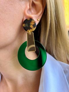 My latest creation is this handmade pair of Clip On Earrings that are made from plexiglass and they also have hypoallergenic metal clips. The upper side of the earrings is in animal print colors, there is a large hoop that seems like a tear drop at the down side in green color, and at the middle of the earring a gold bar connects them and create a really special pair of earrings. Different shapes and different colors create this really special pair of handmade earrings. They are lightweight and Modern Handmade Green Hoop Earrings, Modern Green Round Earrings, Unique Green Plug Earrings, Handmade Green Drop Plug Earrings, Modern Green Dangle Earrings, Modern Green Drop Earrings, Handmade Green Round Clip-on Earrings, Boho Chic Design, Bold Earrings