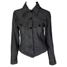 TheRealList presents a black Gucci trucker-style jean jacket, designed by Tom Ford. This jacket, released in 2001, adds the perfect luxury pop to the average jean jacket. The front of the jacket is adorned with black Gucci logo buttons as well as at the breast pockets and cuffs. Follow us on Instagram! @_the_reallist_ Approximate measurements: Size - IT40 34" bust 30" waist 23" shoulder to cuff 19.5" underarm to cuff 19" shoulder to hem 98% cotton, 2% elastane Gucci Black Winter Tops, Jean Jacket Design, Gucci By Tom Ford, Monogram Jacket, Tom Ford Gucci, Gucci Runway, Gucci Jeans, Gucci Jacket, Ford Black