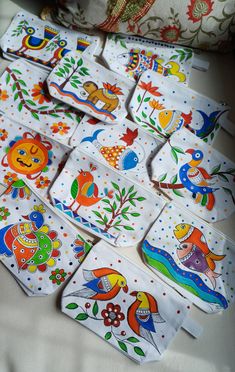 many different designs and colors are on the cloths that have been made into napkins