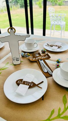 a table set with plates, napkins and utensils