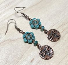 Super cute boho earrings perfect for spring and summer! For these I have paired Czech glass wild rose flower beads in turquoise blue with a copper wash, small Czech glass rondeloles, and antique copper dragonfly charms. These adorable earrings are perfect for everyday! Total length of earrings, including the ear wire, is slightly over 2-1/4".   Thank you for shopping with The Lucie Collection! Interchangeable Jewelry, Jewelry Making Earrings, Summer Earrings, Dragonfly Earrings, Earrings Turquoise, Earrings Beaded, Summer Earring, Homemade Jewelry, Bohemian Earrings