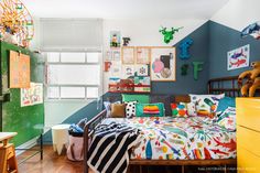 a child's bedroom decorated in bright colors