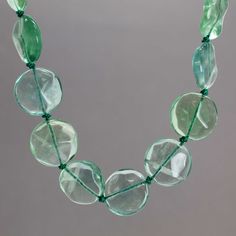 A gorgeous strand of hand knotted Fluorite gemstones! This is an endless strand 32" long, knotted using green silk thread. It makes a statement!100% Natural AAA Green Fluorite Gemstone BeadsBeads are about 20 mm DiameterNecklace is 32" Long, no clasp~ Slides easily over headGreen Silk ThreadArtisan Made in Texas, USAThoughtfully packaged in a signature kraft jewelry box ready to gift Fluorite Gemstone, Fluorite Necklace, Green Fluorite, Bead Shop, Green Silk, Silk Thread, Gemstone Beads, Hand Knotted, Jewelry Box