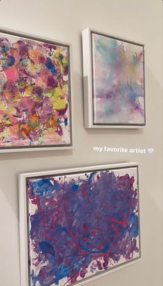 three paintings are hanging on the wall next to each other