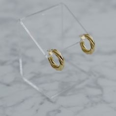 "Pair them with gold rings and necklaces to get a full elegant look. These thick twisted earrings take you to a higher level of the Parisian style - chic, bold and simple. - Materials: 18K gold plated brass and sterling silver posts - Measurements: approximately 0.9\" / 2.3cm in diameter - Note: one earrings is about 7.4g / 0.26oz - The product is tarnish-resistant. The posts are hypoallergenic Q&A 1. What is the material? - It is made from 18K real gold plated brass and sterling silver post Chic Gold-plated Huggie Earrings, Chic Gold Plated Huggie Earrings, Chic Twisted Hoop Earrings, Chic Gold Huggie Earrings, Chic Hypoallergenic Gold Plated Hoop Earrings, Elegant Twisted Gold Plated Hoop Earrings, Elegant Twisted Hoop Earrings For Everyday, Elegant Twisted Huggie Earrings Gift, Elegant Twisted Tarnish-resistant Hoop Earrings