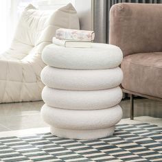 a stack of towels sitting on top of a rug