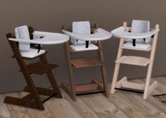 three baby highchairs in various positions on the floor