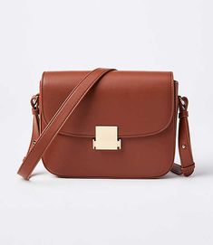 Topped with an extra stylish and sleek clasp closure, this perfectly practical bag is a modern must-have. Shoulder strap with 18" drop. Inside zip pocket. 7 1/2" x 6 1/4" x 1 3/4".,Imported:Imported Loft Modern Shoulder Bag Cognac Women's by Loft Size Regular - One Size Cognac Women's Bags, &, Clutches, Crossbody, Bags Classic Formal Flap Bag With Hasp Closure, Brown Satchel Flap Bag With Hasp Closure, Classic Office Flap Bag With Hasp Closure, Classic Formal Shoulder Bag With Hasp Closure, Brown Crossbody Saddle Bag With Hasp Closure, Brown Office Flap Bag With Hasp Closure, Classic Brown Saddle Bag With Hasp Closure, Formal Flap Shoulder Bag With Fold Over Clasp, Chic Cognac Shoulder Bag With Turn-lock Closure