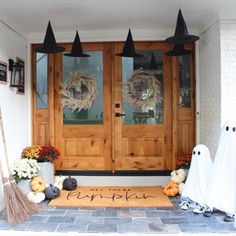 the front door is decorated for halloween with decorations