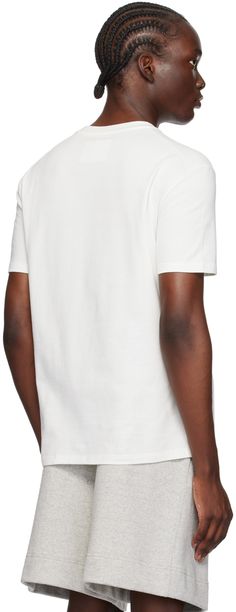 Lightweight cotton jersey T-shirt. · Rib knit crewneck · Logo printed at chest · Dropped shoulders Supplier color: Porcelain White Cotton Jersey Crew Neck Top, White Short Sleeve Cotton Jersey Tops, White Cotton Jersey Short Sleeve Top, White Cotton Top With Ribbed Neckline, White T-shirt With Ribbed Neckline For Everyday, White Cotton Jersey Graphic Tee, White T-shirt With Ribbed Neckline And Relaxed Fit, Oversized Logo Print T-shirt With Drop Shoulder, White Boxy Fit Drop Shoulder T-shirt