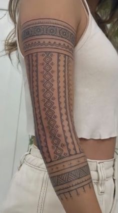 a woman with a tattoo on her arm