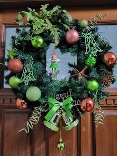 a christmas wreath hanging on the front door