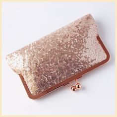 BESPOKE ROSE GOLD SEQUIN CLUTCH BAG, HANDMADE TO ORDER This little clutch purse is ideal to carry a few essential items for an evening out or special occasion such as a wedding. It is handmade to order by me at my studio in Scotland using a sparkly rose gold sequinned tulle fabric and a rose gold tone frame. - Width = approx. 20.5 cm (8 ins) - Height (excluding clasp) = approx. 13cm (5 ins) - Depth = approx. 3cm (1 inch) at the lower edge - Rose gold tone kisslock frame - Soft touch bag which ke Glamorous Rose Gold Rectangular Evening Bag, Rose Gold Rectangular Evening Bag For Events, Glamorous Rose Gold Clutch For Party, Gold Sequin Bags For Gifts, Glamorous Rose Gold Evening Bag, Gold Sequined Bags For Gifts, Formal Gold Compact Wallet, Glamorous Rose Gold Party Clutch, Gold Sequined Bags As Gifts