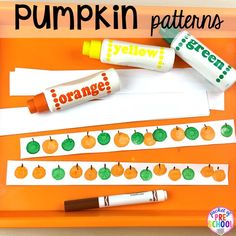 an orange tray with pumpkin patterns and markers