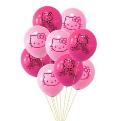 a bunch of pink hello kitty balloons on a stick