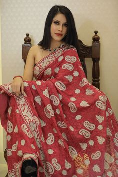 Add a touch of traditional elegance to your wardrobe with this beautiful saree. The saree is made of high-quality fabric and features intricate Aari and Tilla embroidery in a stunning shade of red. The saree is easy to drape, making it perfect for any occasion. Whether you're attending a wedding or a formal event, this saree is sure to make you stand out in the crowd. The embroidery work is done by skilled artisans who have years of experience in the craft. Each saree is made with great attentio Anarkali Chikankari Pre-draped Tussar Silk Saree, Tussar Silk Pre-draped Saree For Traditional Ceremonies, Embroidered Pre-draped Tussar Silk Saree, Traditional Designer Pre-draped Saree, Designer Pre-draped Saree With Chikankari Embroidery, Festive Banarasi Silk Saree With Chikankari Embroidery, Elegant Jamawar Saree With Chikankari Embroidery, Designer Chanderi Pre-draped Saree With Chikankari Embroidery, Bollywood Banarasi Silk Saree With Chikankari Embroidery