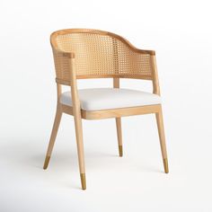 a wooden chair with a white cushion on the seat and backrest, in front of a white background