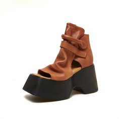 These sandals are designed in a retro style with 60 mm chunky heel. Made from soft leather, soft bottom that ensure all-day comfort. Wear yours with tailoring and denim alike. Color: Brown/BlackMaterial: Top layer cow leatherLining: genuine leatherInsole: PUSole: PU foamHeels: 6Cm/2.36" Fit: Medium to Wide, Runs Normal.Origin: Made in China Production Time: About 3-5 days (Any exceptional case will email you, Please pay attention to your email left) Shipping Time: Free Shipping To most locations Retro Sandals With Leather Sole, Retro Leather Sandals With Leather Sole, Retro Leather Heels For Summer, Retro Leather Summer Heels, Retro Summer Leather Heels, Retro Leather Sandals With Block Heel, Brown Calf Leather Sandals With Sculpted Heel, Modern Leather Sandals With Deep Heel Cup, Summer Calf Leather Sandals With Stacked Heel