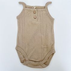 Play Up is a sustainable clothing brand with entirely Portuguese artisan design and manufacturing. They are committed to environmental preservation through their use of natural dyes, recycled fibers, and organic cotton. Sage tank onesie is made with organic cotton. Beige Cotton Onesie For Spring, Casual Beige Cotton Bodysuit, Summer Organic Cotton Onesie For Loungewear, Organic Cotton Fitted Bodysuit For Loungewear, Casual Brown Cotton Bodysuit, Spring Organic Cotton Fitted Bodysuit, Casual Organic Cotton Onesie For Summer, Cream Cotton Bodysuit For Loungewear, Fitted Organic Cotton Casual Bodysuit