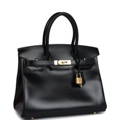 This Birkin is in Black boxcalf leather with gold hardware and has tonal stitching, front flap, two straps with center toggle closure, clochette with lock and two keys, and double rolled handles.The interior is lined with Black chevre and has one zip pocket with an Hermes engraved zipper pull and an open pocket on the opposite side.Collection: DOrigin: FranceCondition: Never worn (Plastic on hardware)Accompanied by: Hermes box, Hermes dustbag, clochette, lock, two keys, clochette dustbag, felt, ribbonMeasurements: 11.75" width x 9.5" height x 6" depth; 4.25" handle drop Luxury Everyday Calf Leather Bag With Lock, Luxury Calf Leather Bag With Lock, Timeless Calf Leather Bag With Hasp Closure, Evening Bags With Lock In Epsom Leather, Evening Epsom Leather Bag With Lock, Gold Epsom Leather Bag With Lock, Business Bags With Lock In Calf Leather, Formal Calf Leather Bag With Lock, Leather Bags With Lock For Everyday Luxury