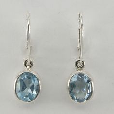 This is a pair of beautiful Blue Topaz Earrings in 925 Sterling Silver. The metal is solid silver without any nickel or other substances causing most allergies making the jewelry hypo allergenic. Size of one Earring in total 3.2 x 1.1 cm 1.21 x 0.41 inch The hooks are 1.8 cm - a bit less than 3/4 inch - in length. You will receive the item in a gift box - perfect to surprise someone or yourself. Usually we ship on the same day we receive the payment for the order. We want you to be happy with yo Blue Oval Hallmarked Earrings, Artisan Jewelry Earrings, Blue Topaz Earrings, Happy Customer, Handcrafted Artisan Jewelry, Topaz Earrings, 925 Sterling Silver Earrings, Fine Jewellery Earrings, Solid 925 Sterling Silver