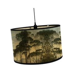 a lamp shade with trees on it