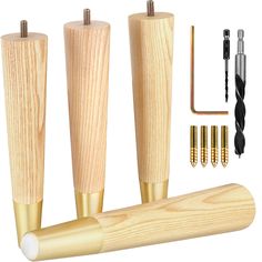 three wooden dowels with screws and other woodworking tools next to them on a white background