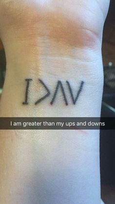 a wrist tattoo that says i am greater than my ups and downs