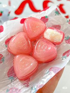 there are heart shaped lollipops wrapped in plastic