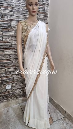 This is designer party wear saree embellished with mirror work. Blouse is made in silk fabric embellished with mirror work. Saree is made in georgette fabric embellished with mirror work all over.  Stitching  For stitched dresses you can chose from size chart or can message us for customization.our team will send you size chart for customization. Feel free to convo for any details to help you in your selection because customize dresses cannot be return or exchange.  Note: color may slightly vary Reception Gota Work Pre-draped Saree, Embellished Chanderi Pre-draped Saree, Wedding Embellished Pre-draped Saree In Chinon, Party Wear Pre-draped Saree With Mirror Work For Navratri, Art Silk Pre-draped Saree With Gota Work For Reception, Traditional Saree With Mirror Work For Reception, Navratri Embellished Chanderi Pre-draped Saree, Party Wear Embellished Pre-draped Saree For Festivals, Art Silk Pre-draped Saree With Mirror Work For Reception