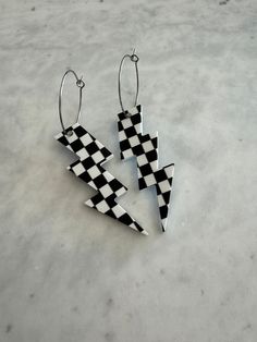 Do you love racing?! Then these are the perfect earrings for you! Great for your day or night at the race track or anywhere! Super light weight and comfy! The 2" lightning bolts are cut from black and white checkered acrylic printed on both sides and hung from 1" hypoallergenic stainless steel hoops! Total length just less than 3". Race Car Earrings, Checkered Accessories, Checkered Seed Bead Earrings, Checkered Earrings Clay, Checker Clay Earrings, Checkered Earrings, Lighting Bolt Earring, Lightning Bolts, Resin Earrings