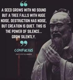 a statue with a quote on it that says, seed grows with no sound but a tree falls with huge noise