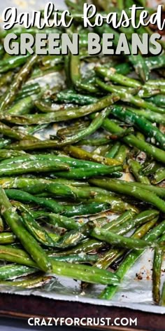 green beans laid out on a sheet pan with words on the photo saying the name of the recipe Green Beans In The Oven, Green Bean Recipes Oven, Roasted Garlic Green Beans, Roasted Fresh Green Beans, Pan Green Beans, Green Bean Side Dish Recipes, Oven Green Beans, Easy Roasted Garlic, Fresh Green Bean Recipes