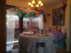 the table is set up for a birthday party