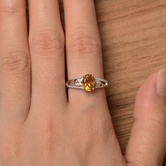 It is a natural citrine ring. The main stone is 6 mm*8 mm oval cut.weight about 1.14 carats. The basic metal is sterling silver and plated with rhodium. To change the metal to a solid gold (white/rose) or platinum is also available, please ask for a quotation if you want. You can also go to my shop Home for more elegant rings: https://www.etsy.com/shop/godjewelry?ref=hdr_shop_menu More citrine rings: https://www.etsy.com/shop/godjewelry?search_query=citrine Customization is always welcome and pl Yellow Oval Birthstone Promise Ring, Engagement Ring Oval Cut, Elegant Rings, November Birthstone Ring, Engagement Ring Oval, Yellow Gemstones, Citrine Ring, Citrine Crystal, Natural Citrine