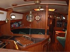 the inside of a boat with wood paneling