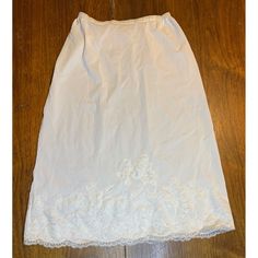 Vintage Artemis Size 26 skirt slip looks new! Beautiful lace and elastic is in perfect condition! No stains or wear. No snags or tears on lace. 23" long 10 1/2" no stretch waist, stretching to 16" Features: * White * Size 26 * Vintage lace * 23" * Waist 10" to 16" * Skirt slip Size: Womens 26 Condition: Pre-Owned Like New Excellent condition Fitted Lace Bottoms For Daywear, Fitted Lace Skirt With Lace Work, Stretch Lace Long Skirt, Long Stretch Lace Skirt, Daywear Lace Lined Skirt, Lace Lined Skirt For Daywear, Skirted Stretch Bottoms With Lace Trim, Daywear Long Lace Skirt, Vintage Style Stretch Bottoms With Lace Trim