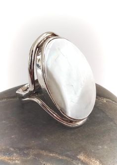 A handcrafted solid sterling silver and Mother Of Pearl ring. The face of the ring measures a large 26mm by 17mm and the ring is in excellent condition. The size is 6.5 US or approx M.5 UK. The ring is hallmarked 925 and would suit a male or female. Please note that all of our jewellery is cleaned in an ultra sonic cleaner before being packed. Please feel free to ask any questions, I'm happy to help, and many thanks for visiting our new Etsy store. Ultra Sonic, Birthday Gifts For Him, Ladies Jewellery, Birthday Gift For Him, Christmas Birthday Gifts, I'm Happy, Silver Man, Pearl Ring, Christmas Birthday