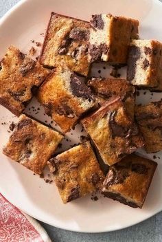 a white plate topped with brownies cut into squares